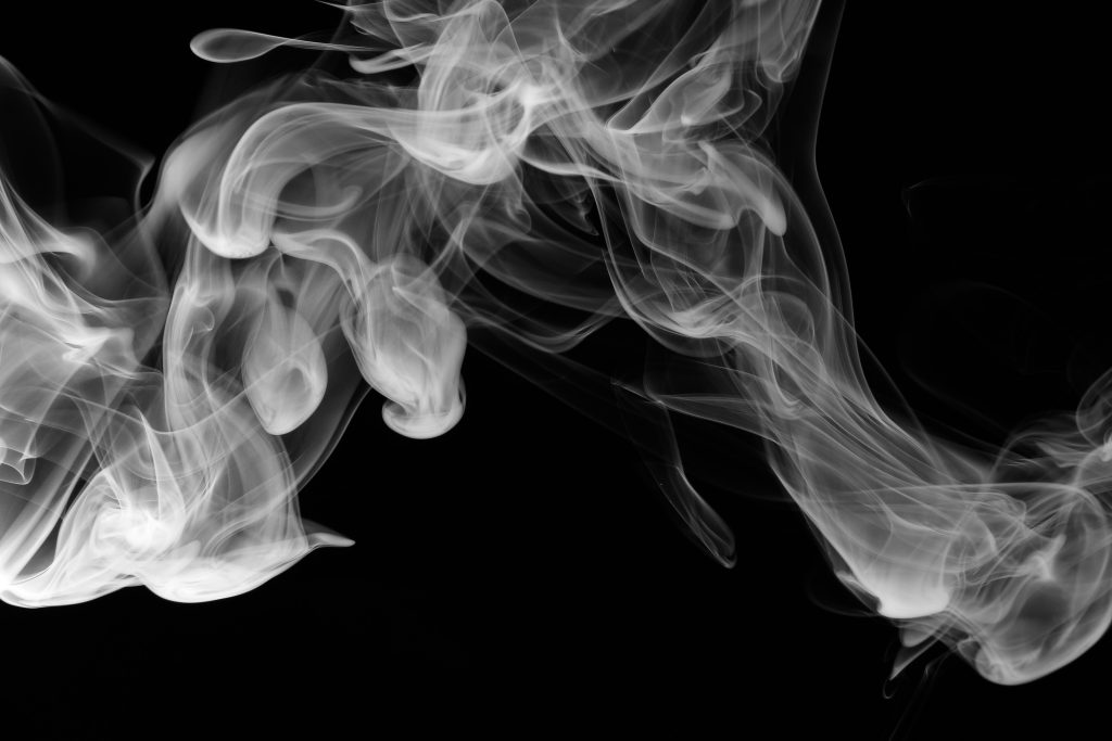 A room filled with smoke. Ensuring Compliance with EN 12101-2: A Guide for Landlords.